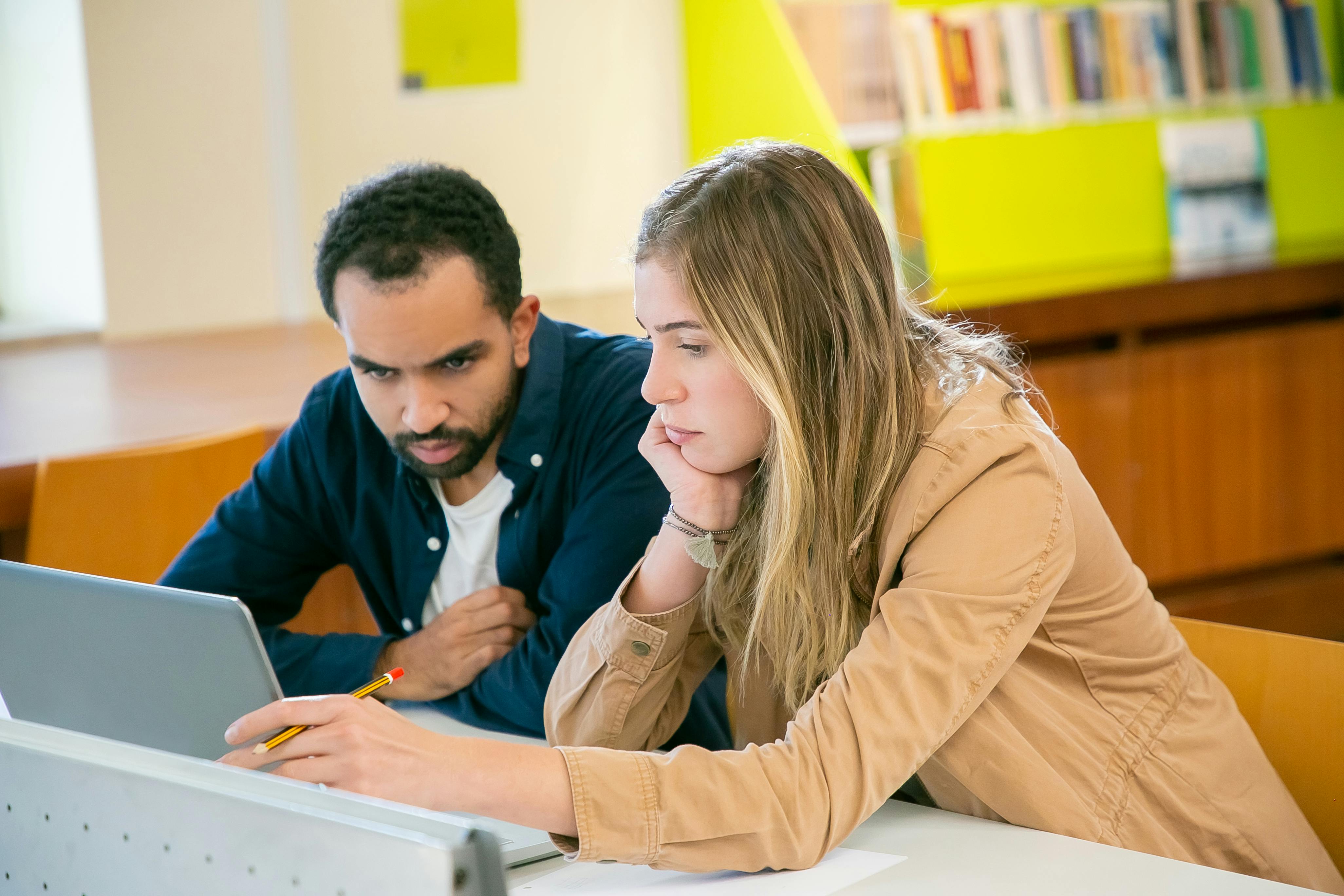Students collaborating on business studies in a modern learning environment